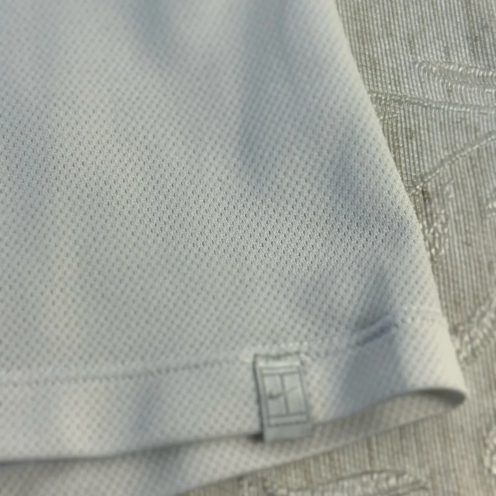 Nike Dri-FIT V-neck short-sleeve athletic top‎ white with teal. Size M